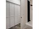 Bathroom featuring a bathtub and white shuttered closet doors at 2679 Haines Bayshore Rd, Clearwater, FL 33760