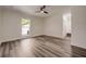 Bright bedroom with ceiling fan, sleek floors, and natural light at 2679 Haines Bayshore Rd, Clearwater, FL 33760