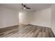 Large bedroom with sleek flooring, neutral walls, and ceiling fan at 2679 Haines Bayshore Rd, Clearwater, FL 33760