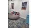 Comfortable game room with fun decor, beanbag chair, and colorful pillows at 2679 Haines Bayshore Rd, Clearwater, FL 33760