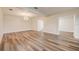 Bright and open living room with modern flooring, ample space, and stylish lighting, great for entertaining at 2679 Haines Bayshore Rd, Clearwater, FL 33760