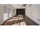 Living room features hardwood floors, built-in shelves, and backyard access at 2679 Haines Bayshore Rd, Clearwater, FL 33760