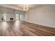 Bright, open living room featuring modern flooring, an elegant fireplace, and abundant natural light from large windows at 2679 Haines Bayshore Rd, Clearwater, FL 33760