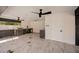 Inviting outdoor kitchen with built-in grill, granite countertops, and ceiling fans at 2679 Haines Bayshore Rd, Clearwater, FL 33760