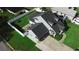 This aerial view shows the home, the yard, and the driveway at 2797 Cordova S Way, St Petersburg, FL 33713