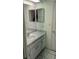 Cozy bathroom featuring a vanity with a sink, white cabinets, and ample lighting at 2797 Cordova S Way, St Petersburg, FL 33713