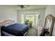 Bright bedroom with a bay window, work space, and comfortable bed, perfect for relaxation at 2797 Cordova S Way, St Petersburg, FL 33713