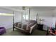 Primary bedroom featuring large bed, ceiling fan, and natural light at 2797 Cordova S Way, St Petersburg, FL 33713