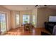 Bright dining room features hardwood floors, bay window, and a door to the outside at 2797 Cordova S Way, St Petersburg, FL 33713