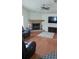 Spacious living room showcasing hardwood floors, a fireplace, and ample room for relaxation and entertainment at 2797 Cordova S Way, St Petersburg, FL 33713