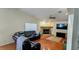 Open living room featuring vaulted ceilings, fireplace, ceiling fan, and hardwood floors at 2797 Cordova S Way, St Petersburg, FL 33713