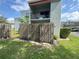 Fenced backyard with partial view of the building, offering a sense of privacy and outdoor space at 2868 Somerset Park Dr # 103, Tampa, FL 33613
