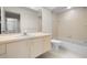 The bathroom features a single sink vanity, tile floors, and a shower-tub combo at 3066 Landmark Blvd # 1305, Palm Harbor, FL 34684
