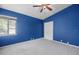 Cozy bedroom features plush carpeting, and a standard-sized window for natural lighting at 3066 Landmark Blvd # 1305, Palm Harbor, FL 34684