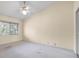 Bright bedroom features neutral paint, plush carpeting, and a standard-sized window at 3066 Landmark Blvd # 1305, Palm Harbor, FL 34684