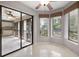 Bright breakfast nook featuring tile floors, fan, and windows providing natural light and views of the outdoors at 3066 Landmark Blvd # 1305, Palm Harbor, FL 34684