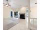Spacious living room features tile flooring, ceiling fan, fireplace, and lots of natural light at 3066 Landmark Blvd # 1305, Palm Harbor, FL 34684