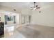 Bright open living room with carpet, tile floors, fireplace, and lots of natural light at 3066 Landmark Blvd # 1305, Palm Harbor, FL 34684
