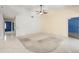 Spacious living room featuring carpet and tile flooring, ceiling fan, and neutral wall colors at 3066 Landmark Blvd # 1305, Palm Harbor, FL 34684