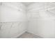 The walk-in closet is fitted with wire shelving on all sides of the space at 3066 Landmark Blvd # 1305, Palm Harbor, FL 34684