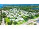 An aerial view showcases a tranquil residential neighborhood surrounded by lush greenery and open spaces at 3122 37Th S Ln # C, St Petersburg, FL 33711
