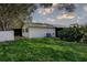 Backyard with lush green grass and an air conditioning unit at 3122 37Th S Ln # C, St Petersburg, FL 33711