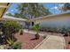 Charming home entrance featuring a stone walkway, landscaped garden, and freshly mulched beds at 3122 37Th S Ln # C, St Petersburg, FL 33711