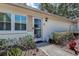 Home entrance featuring a glass door, and landscaped garden at 3122 37Th S Ln # C, St Petersburg, FL 33711