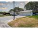 View of three garages and a parked car in front of a house at 3122 37Th S Ln # C, St Petersburg, FL 33711