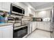 Well-equipped kitchen featuring stainless steel appliances, sleek countertops, and modern fixtures at 3122 37Th S Ln # C, St Petersburg, FL 33711