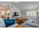 Comfortable living room featuring stylish furniture, including a plush blue pillow, plus bright natural lighting at 3122 37Th S Ln # C, St Petersburg, FL 33711