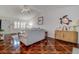 Cozy living room with unique tile floors, a comfortable couch, and a decorative turtle mirror at 3122 37Th S Ln # C, St Petersburg, FL 33711
