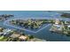 Aerial view showcasing the property's waterfront location, boat access, and proximity to amenities at 3174 Sanibel Dr, Hernando Beach, FL 34607
