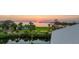 Beautiful bay front property featuring gorgeous sunset views with lush tropical landscaping at 3174 Sanibel Dr, Hernando Beach, FL 34607