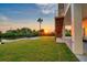 Backyard with dock, canal, and stairs to the deck to enjoy the sunset views at 3174 Sanibel Dr, Hernando Beach, FL 34607