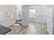 Bright bathroom with glass shower, wood-look tile, and walk-in closet at 3174 Sanibel Dr, Hernando Beach, FL 34607