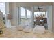 Bedroom showcasing serene waterfront view and access to outdoor seating area at 3174 Sanibel Dr, Hernando Beach, FL 34607