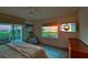 Cozy bedroom with natural light, water views, ceiling fan, and comfortable furnishings at 3174 Sanibel Dr, Hernando Beach, FL 34607