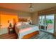 Bright bedroom with a bed, light wood furniture, and access to a private balcony at 3174 Sanibel Dr, Hernando Beach, FL 34607
