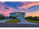 Beautiful two-story home with metal roof, well-manicured lawn, and charming curb appeal at 3174 Sanibel Dr, Hernando Beach, FL 34607