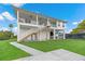 Coastal home features elevated design, private balconies, and lush landscaping, perfect for waterfront living at 3174 Sanibel Dr, Hernando Beach, FL 34607