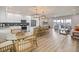 Spacious kitchen flows into living area, boasting modern appliances and a large island at 3174 Sanibel Dr, Hernando Beach, FL 34607