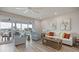 Cozy living room with water views and access to balcony at 3174 Sanibel Dr, Hernando Beach, FL 34607