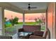 Inviting covered porch with wicker furniture to enjoy sunset and waterfront views at 3174 Sanibel Dr, Hernando Beach, FL 34607