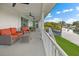 Relaxing porch area with cozy seating, offering serene waterfront views from an elevated perspective at 3174 Sanibel Dr, Hernando Beach, FL 34607