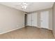 Spacious bedroom with tile flooring, a ceiling fan, and a double closet at 3455 Countryside Blvd # 31, Clearwater, FL 33761