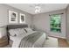 Serene bedroom with neutral decor, plush rug, ceiling fan, and sunny window view at 3455 Countryside Blvd # 31, Clearwater, FL 33761