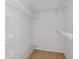 Walk-in closet with built-in shelving units for organized storage solutions at 3455 Countryside Blvd # 31, Clearwater, FL 33761