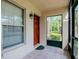 Cozy screened front porch with a covered front door area at 3455 Countryside Blvd # 31, Clearwater, FL 33761