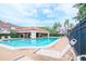 Inviting community pool with lounge chairs and shade, perfect for relaxation and summer fun at 3455 Countryside Blvd # 31, Clearwater, FL 33761